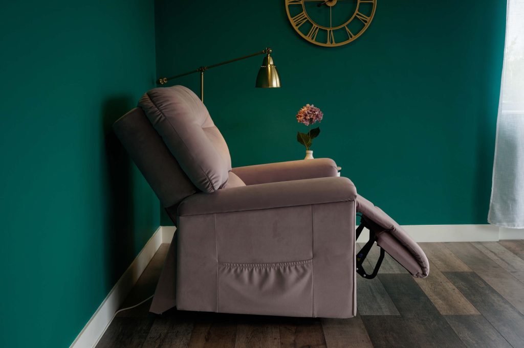 A velvet riser recliner chair in a reclined position. 