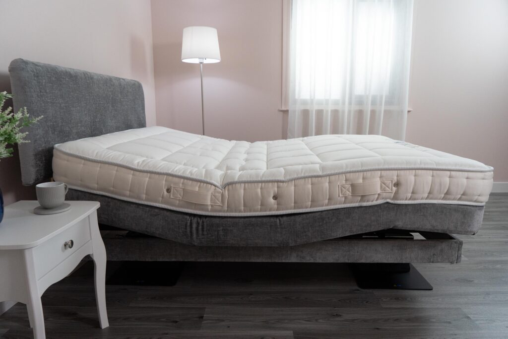 An adjustable mattress being used with an adjustable bed.