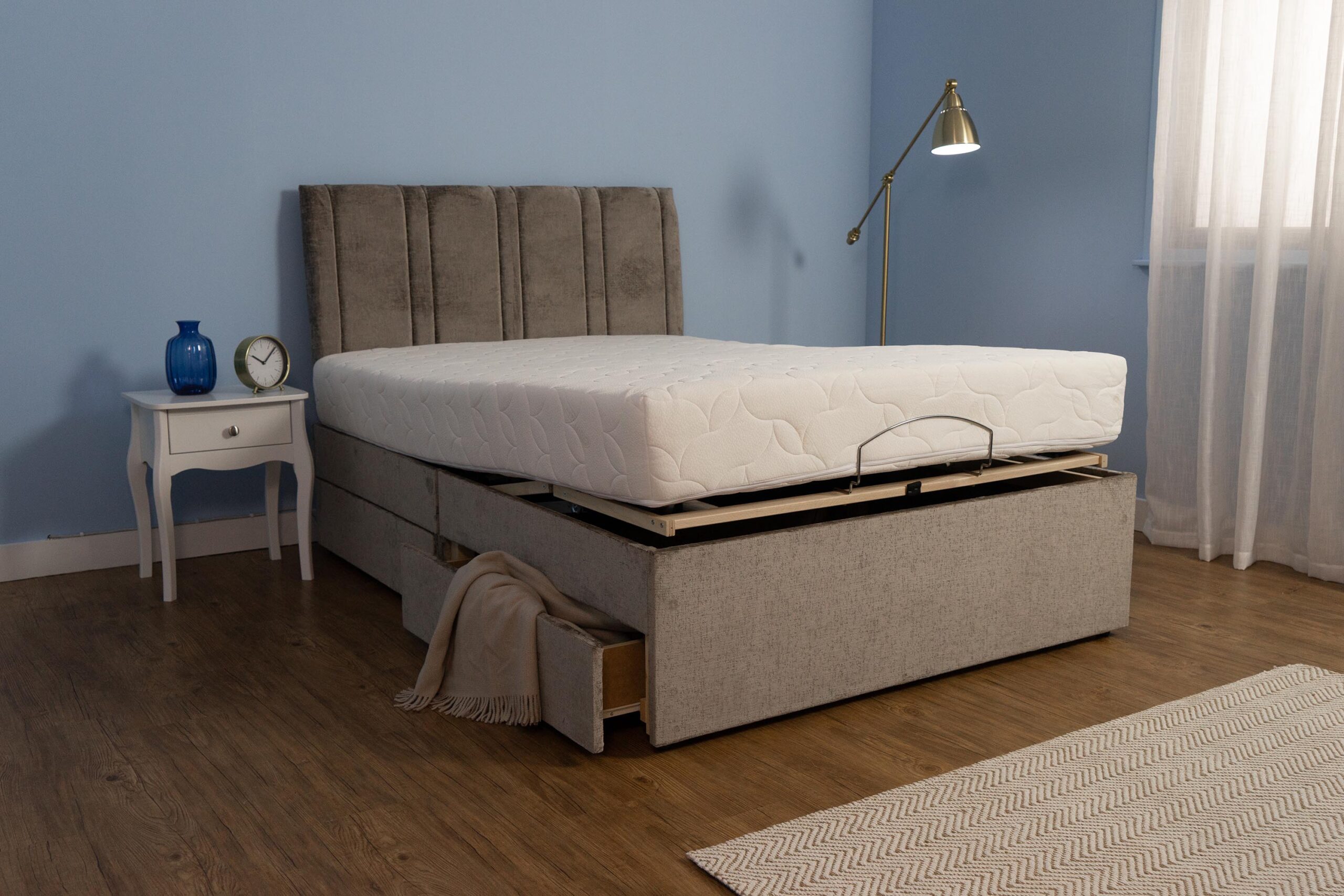 An adjustable divan ottoman bed with underbed storage.