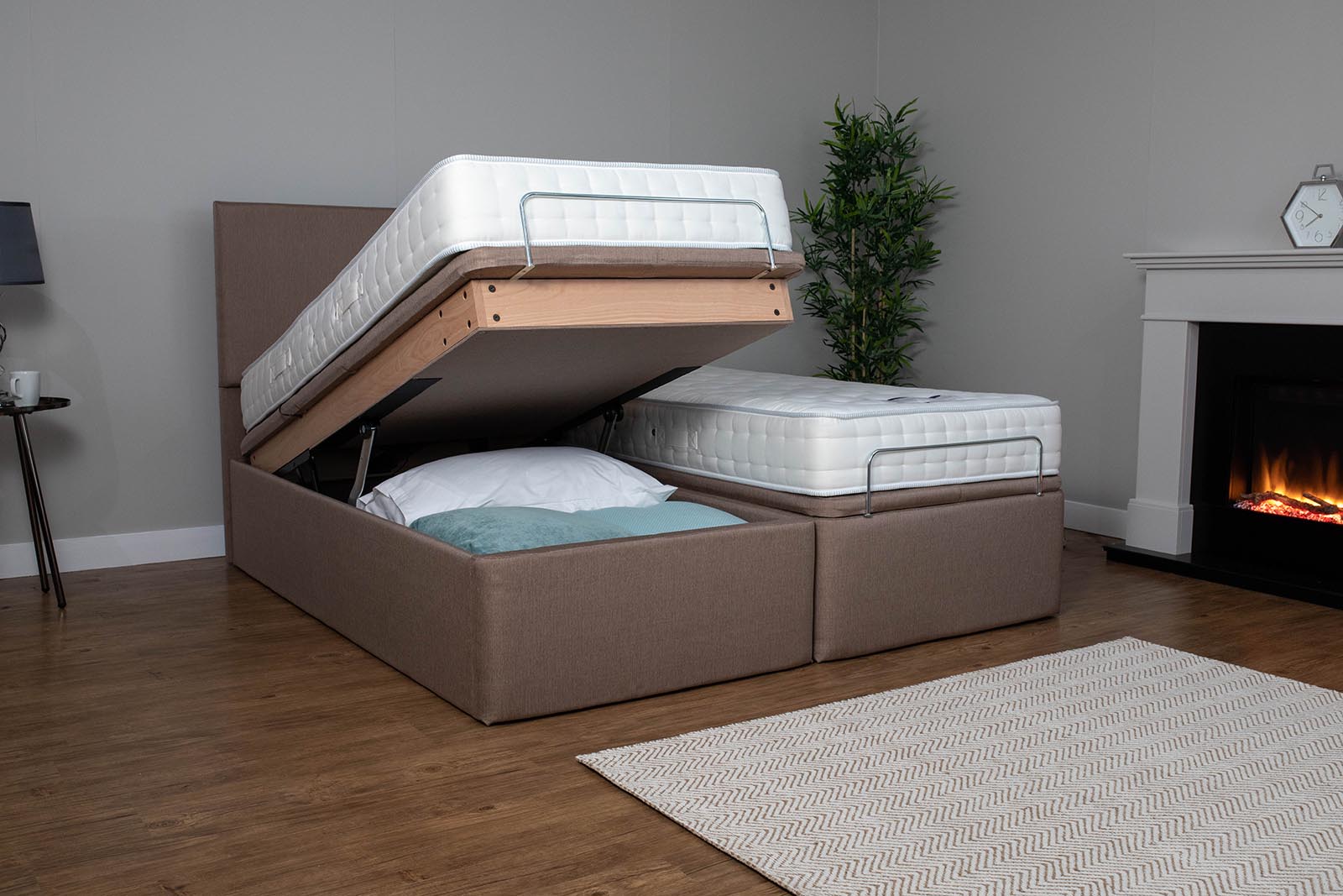 A twin ottoman bed, open on one side to show the storage space beneath. Read our article where we ask are ottoman beds good for your sleep and home?